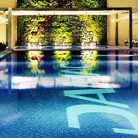 Damac Maison Cour Jardin Dubai Exterior photo The swimming pool at the hotel