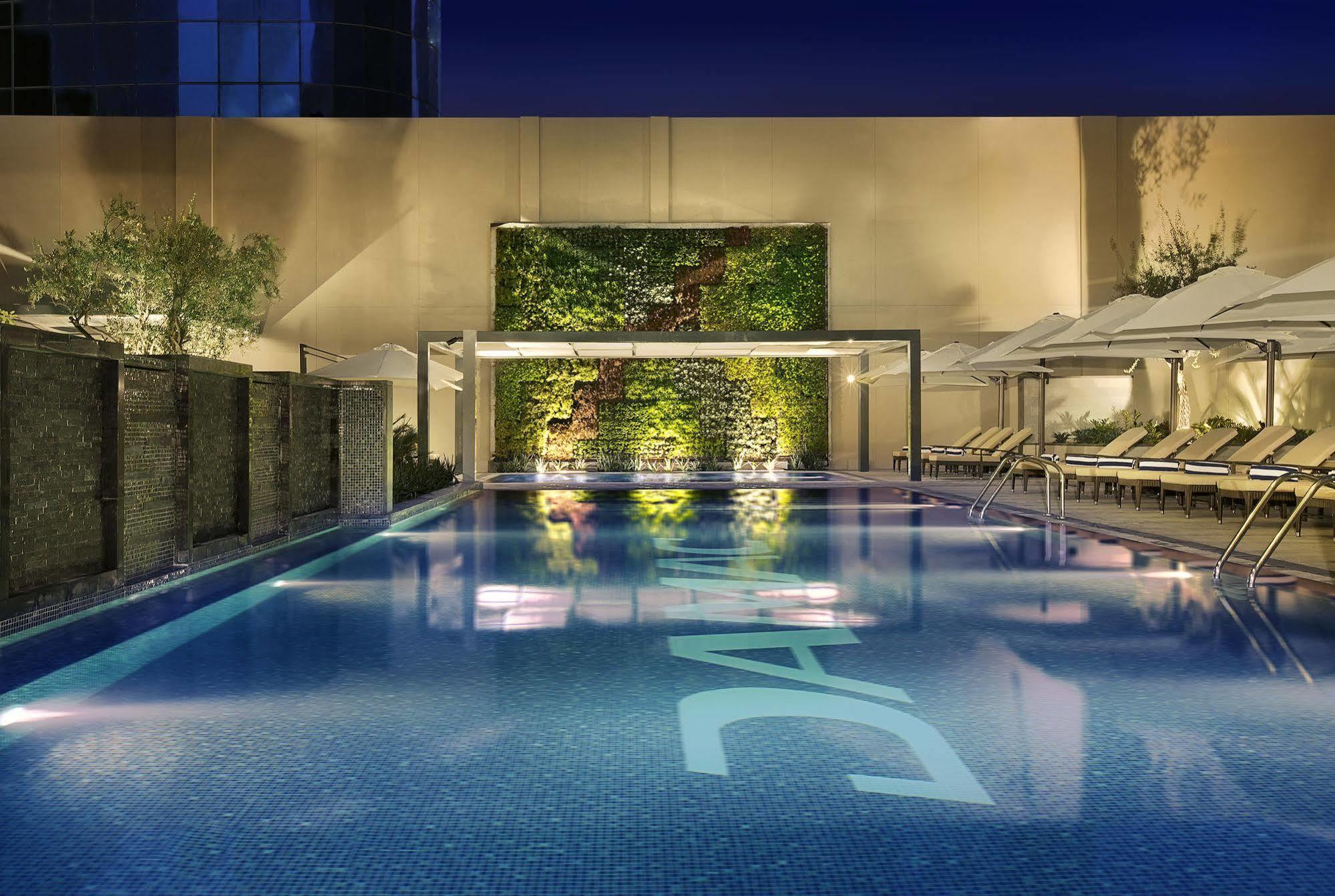 Damac Maison Cour Jardin Aparthotel Dubai Exterior photo The pool at the hotel